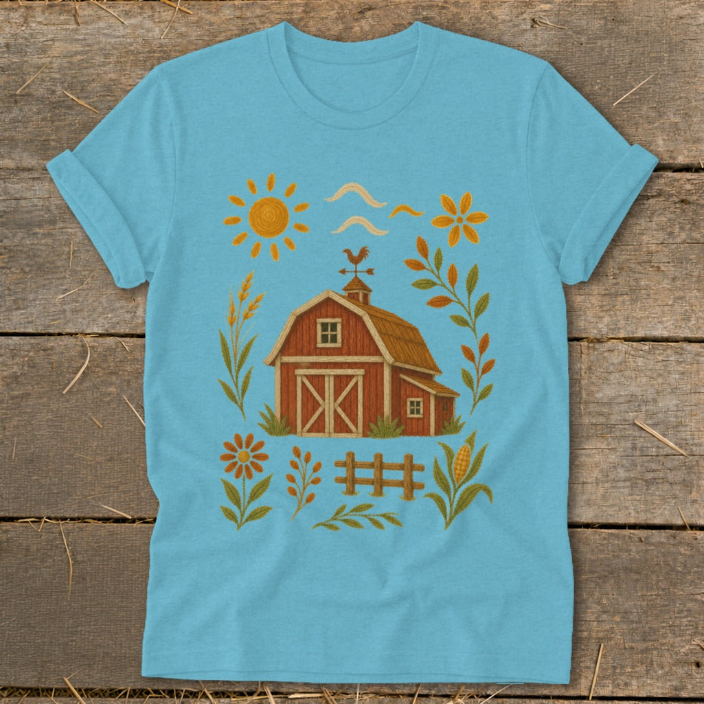 Light blue t-shirt with a red barn, sun, and farm-themed accents.