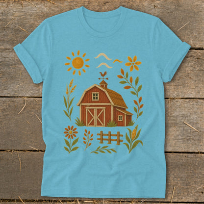 Light blue t-shirt with a red barn, sun, and farm-themed accents.