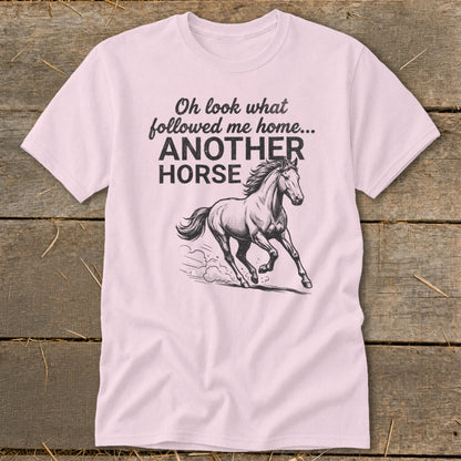 Pink t-shirt with text "Oh look what followed me home... ANOTHER HORSE" and a horse graphic.