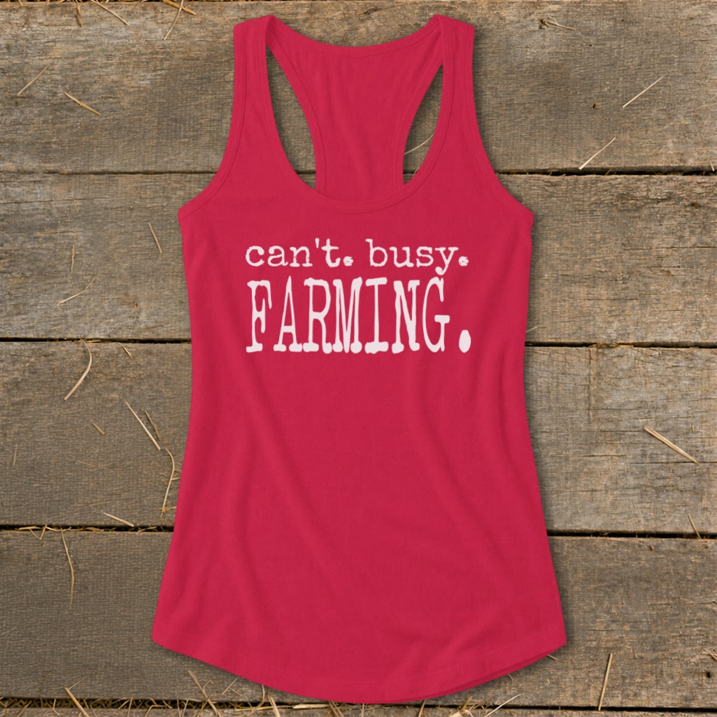 Pink tank top with white text that reads "can't. busy. FARMING."