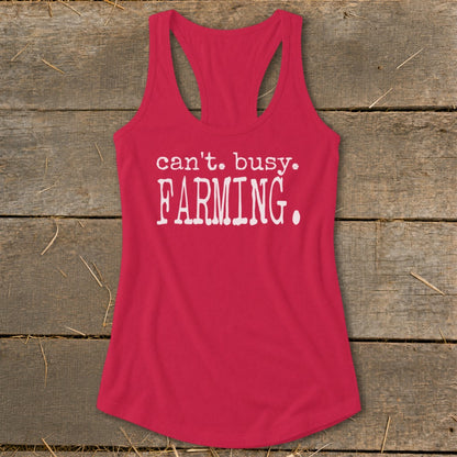 Pink tank top with white text that reads "can't. busy. FARMING."