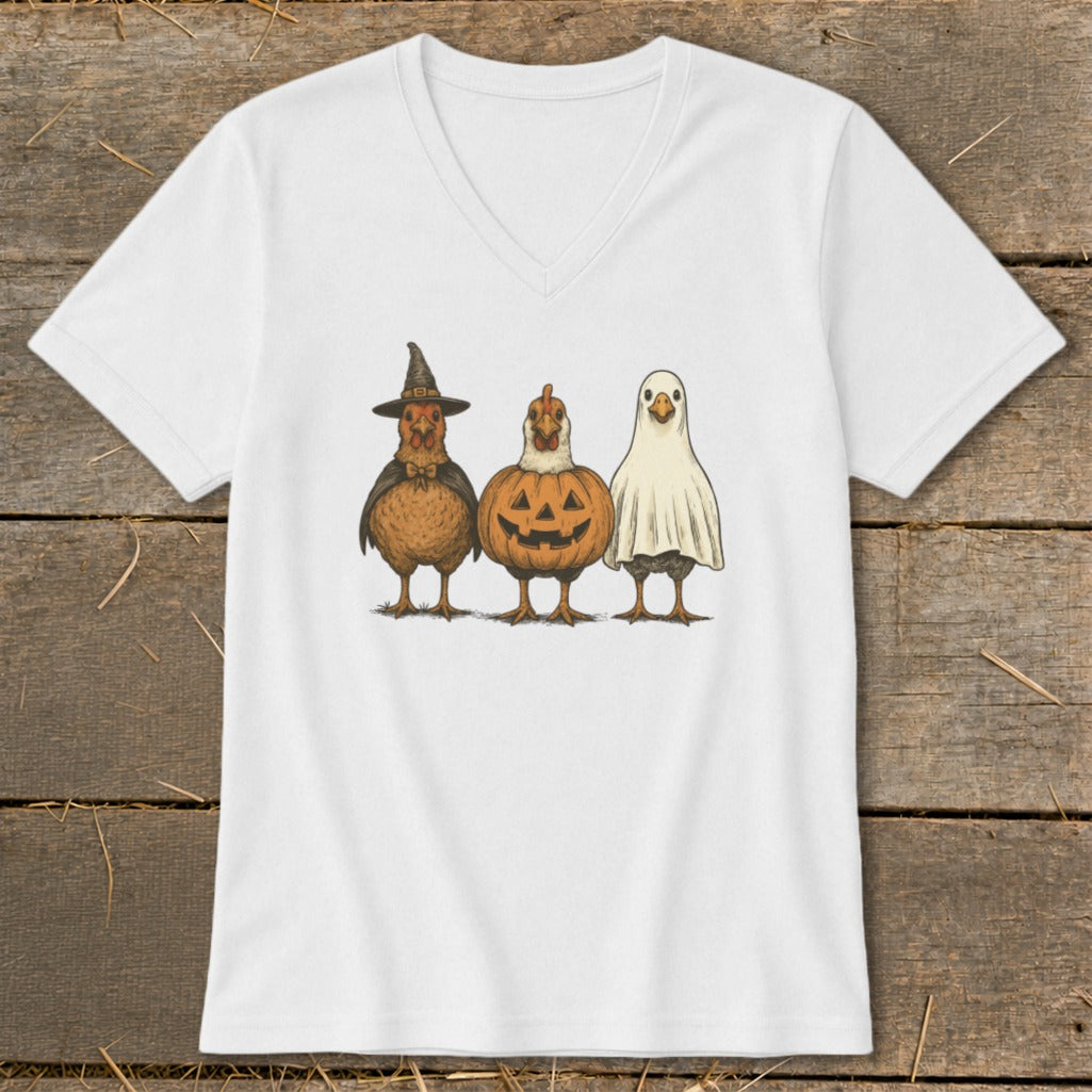 White t-shirt with three chickens in Halloween costumes: witch, pumpkin, and ghost.
