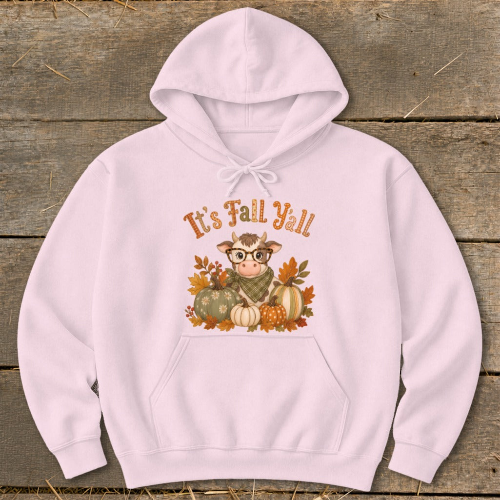 Pink hoodie with a graphic of a cow, pumpkins, and autumn leaves with "It's Fall Y'all" text.