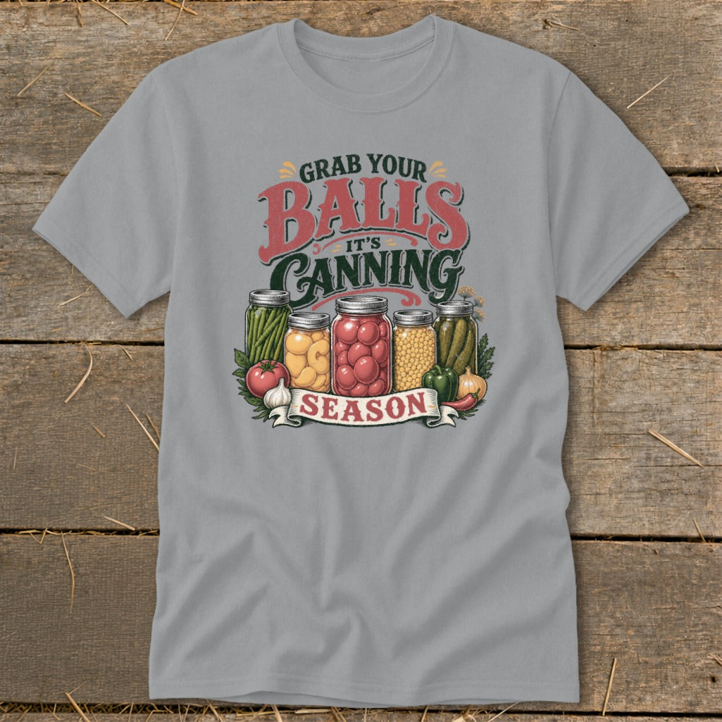 T-shirt graphic with jars of canned vegetables and text "Grab your balls, it's canning season."