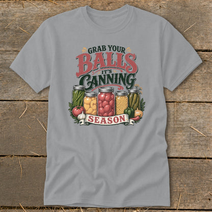 T-shirt graphic with jars of canned vegetables and text "Grab your balls, it's canning season."