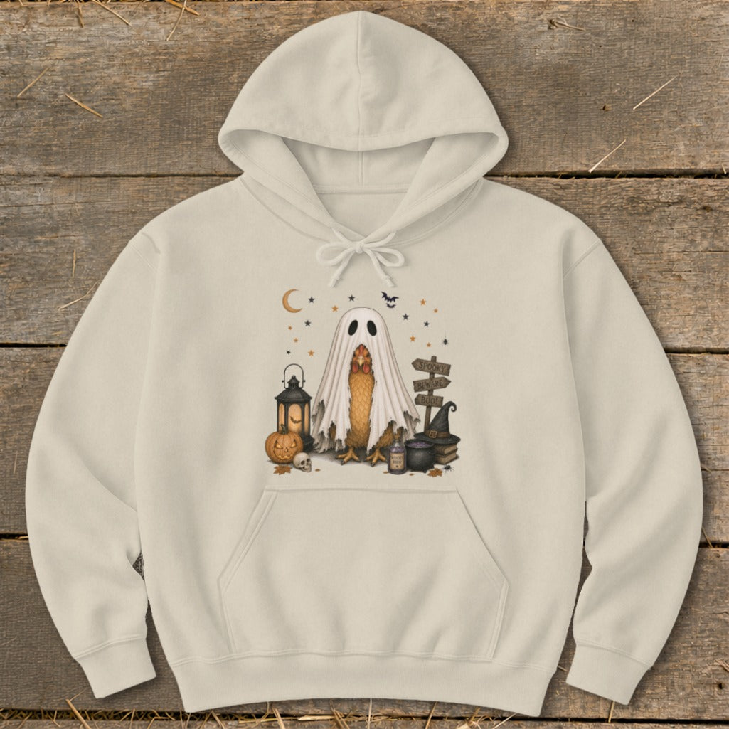 Cream hoodie with Halloween chicken in ghost costume, pumpkin, lantern, and witch hat.