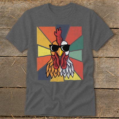 Rooster wearing sunglasses with a colorful geometric background on a t-shirt.
