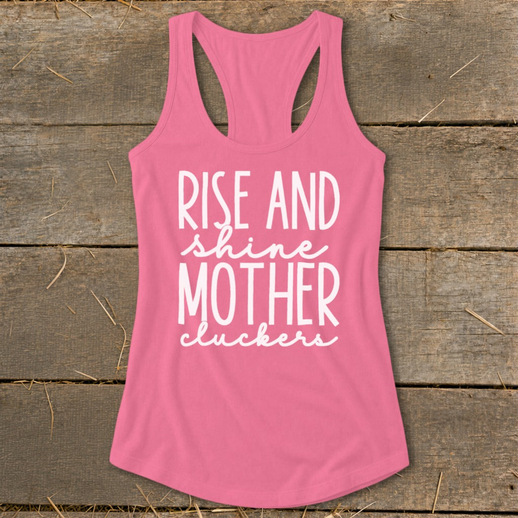 Pink tank top with white text reading "RISE AND shine MOTHER cluckers".