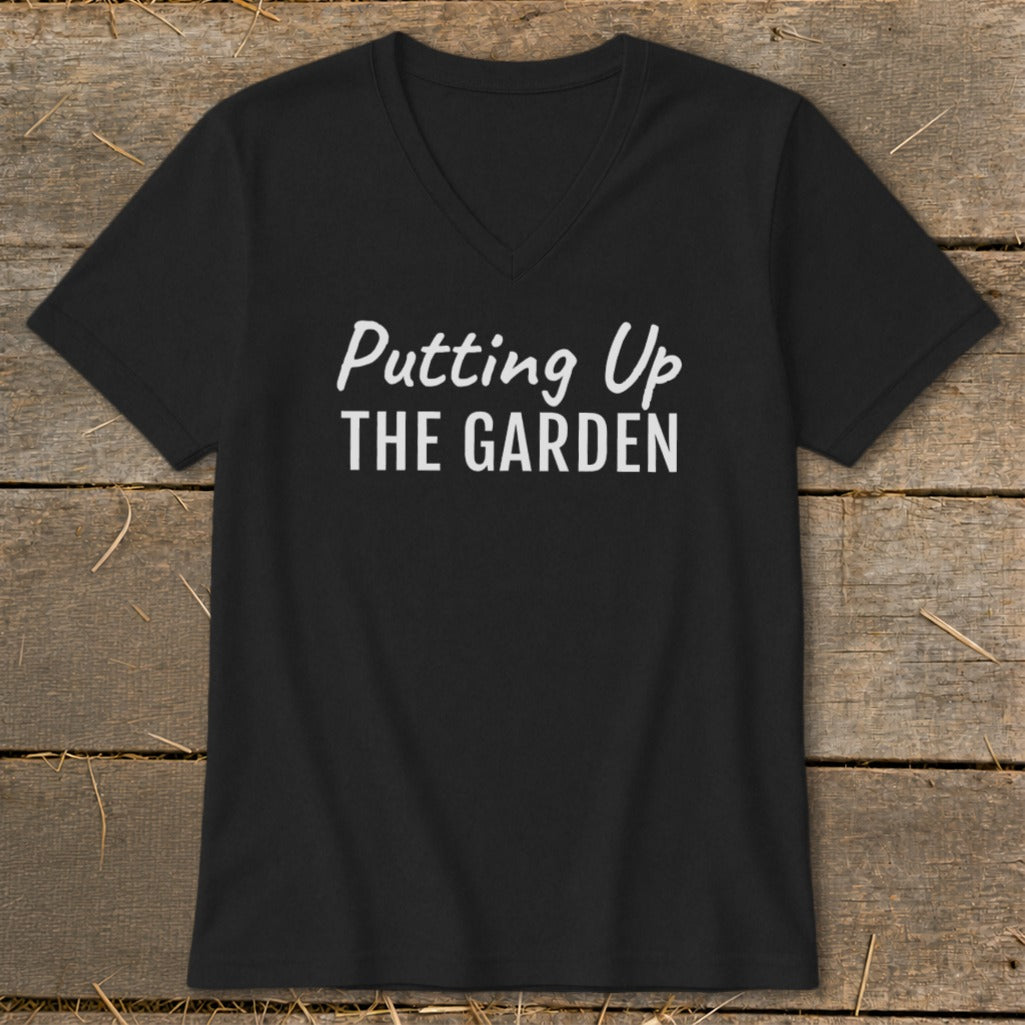 Black V-neck t-shirt with white text that reads "Putting Up THE GARDEN".