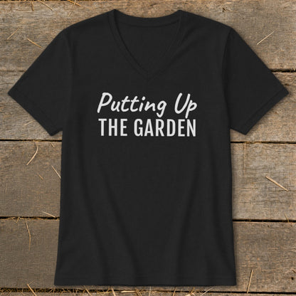 Black V-neck t-shirt with white text that reads "Putting Up THE GARDEN".