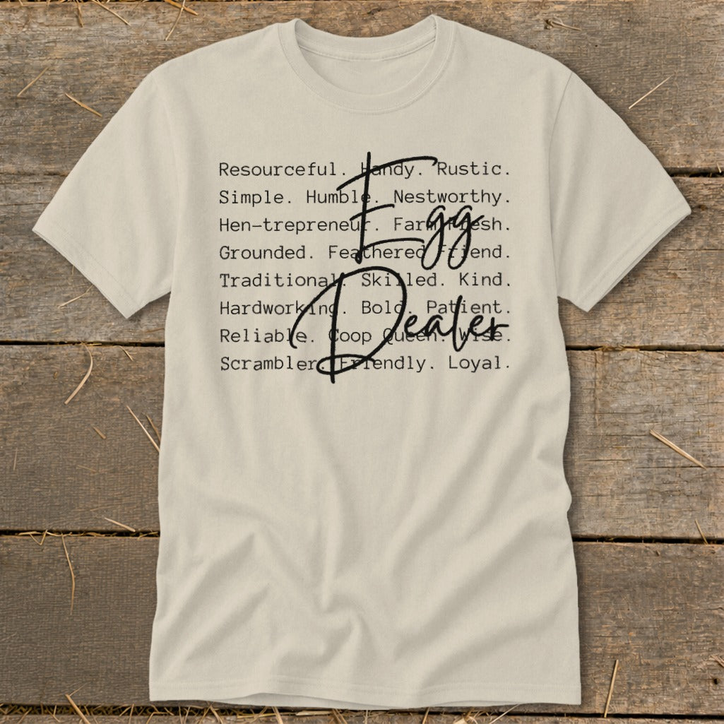 Cream t-shirt with list of words and "Egg Dealer" text.