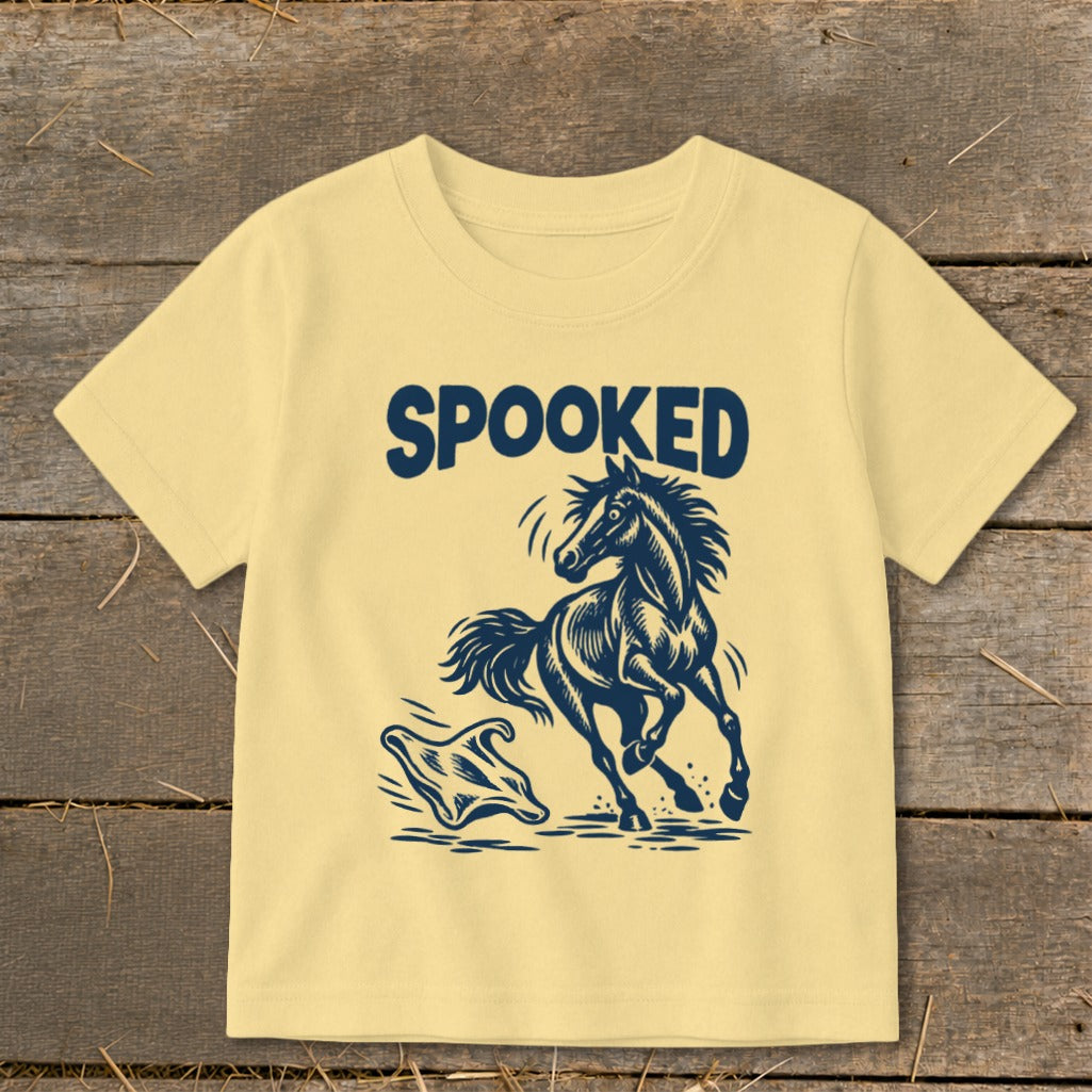 Yellow t-shirt with "SPOOKED" and a startled horse facing a ghost.