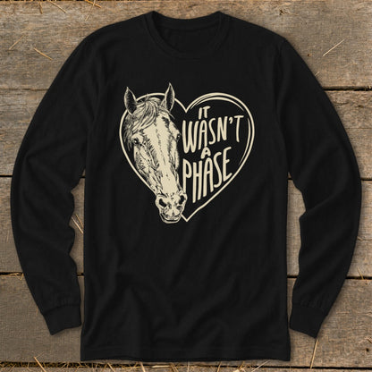 Black long-sleeve shirt with a horse head inside a heart and the text "it wasn't a phase."