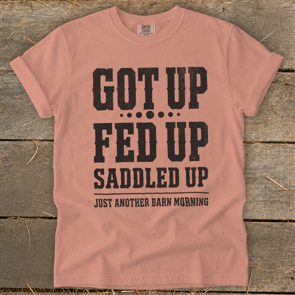 Peach shirt with black text reading "Got Up Fed Up Saddled Up Just Another Barn Morning."
