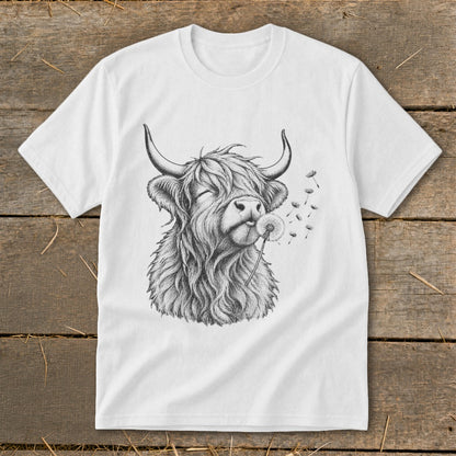 White t-shirt with black sketch of a Highland cow blowing a dandelion.