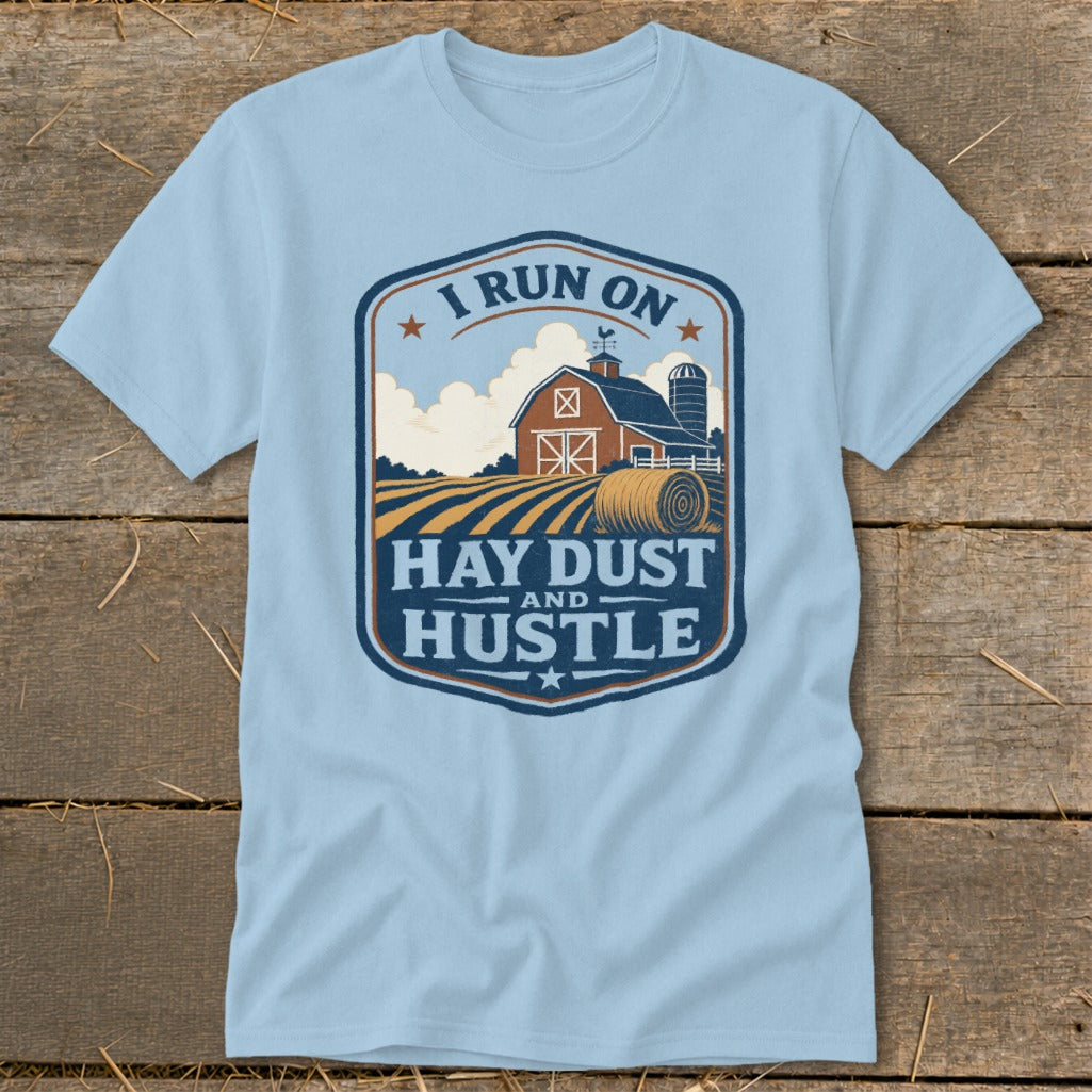 Light blue t-shirt with "I RUN ON HAY DUST AND HUSTLE" farm graphic.
