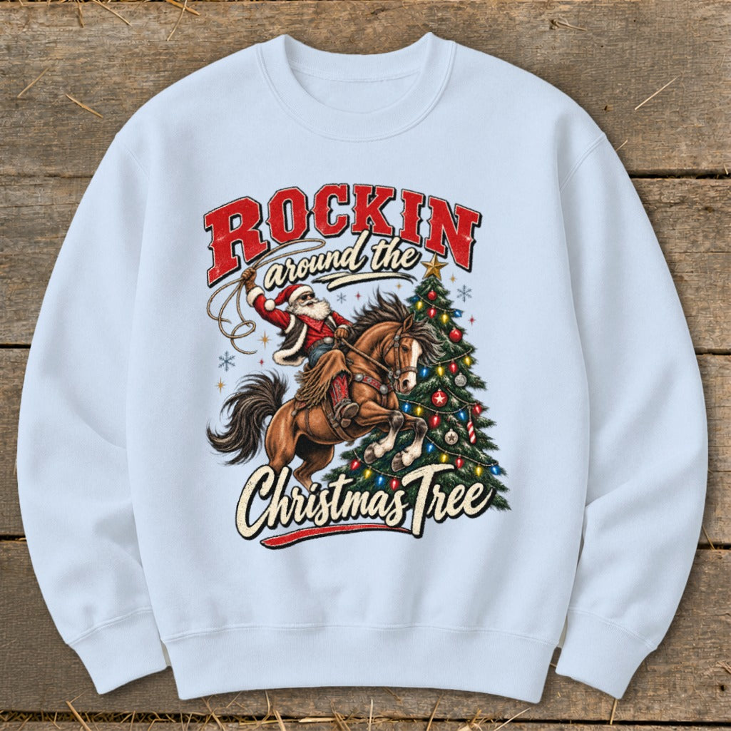 Santa on a horse with a lasso, near a Christmas tree. "Rockin around the Christmas Tree" text.