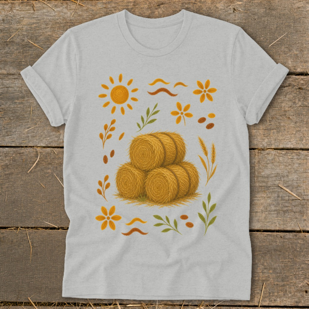 Light gray t-shirt with a fall harvest graphic featuring hay bales, sun, and leaves.