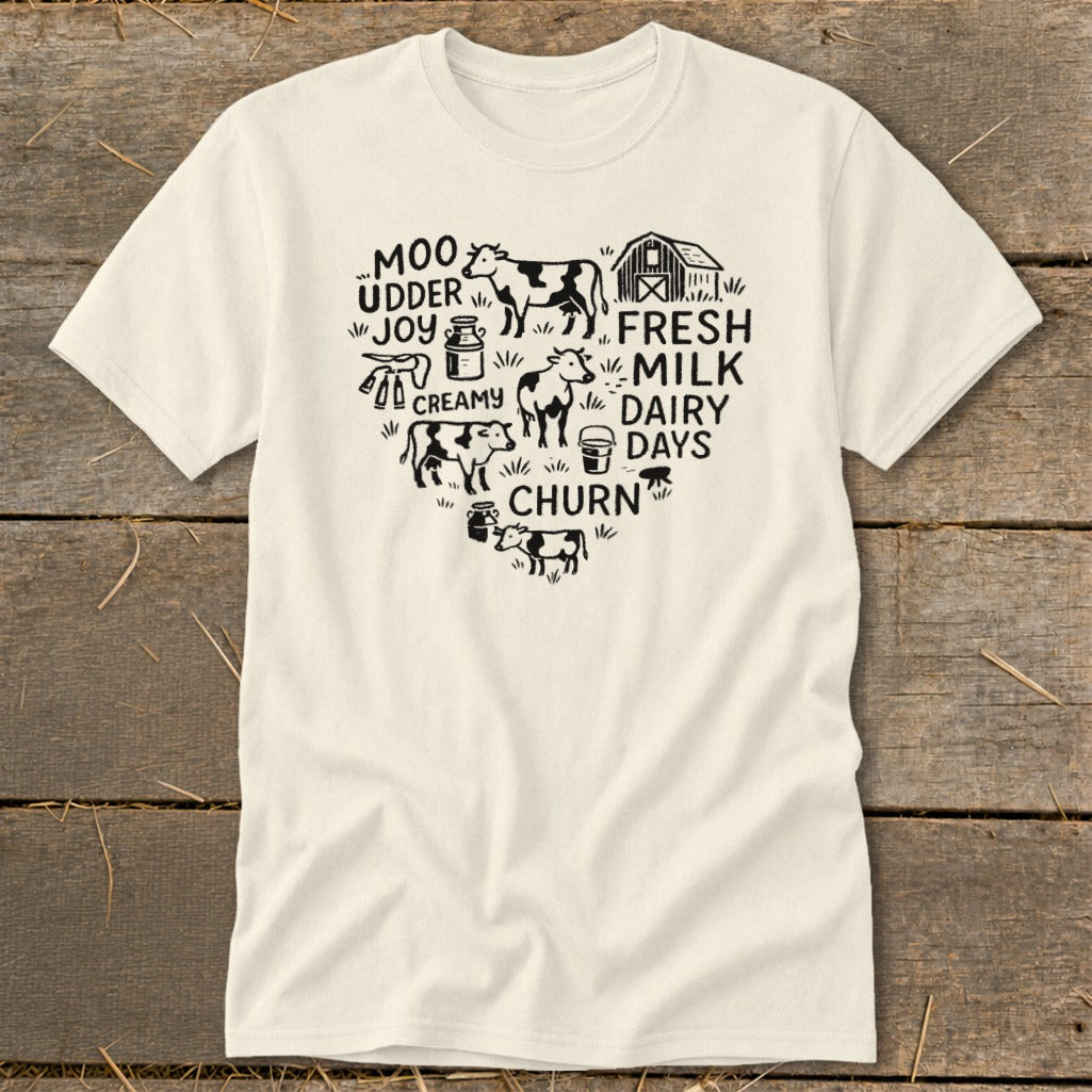 Creamy Dairy Days Moo Udder Joy Churn heart graphic with cows, barn, and milk jug.