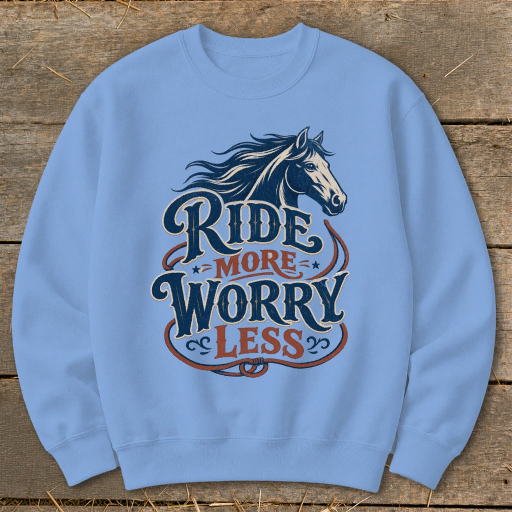 Light blue crewneck sweatshirt with horse graphic and "Ride More Worry Less" text.