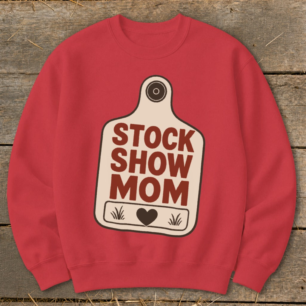 Red sweatshirt with "STOCK SHOW MOM" text on a tag graphic.