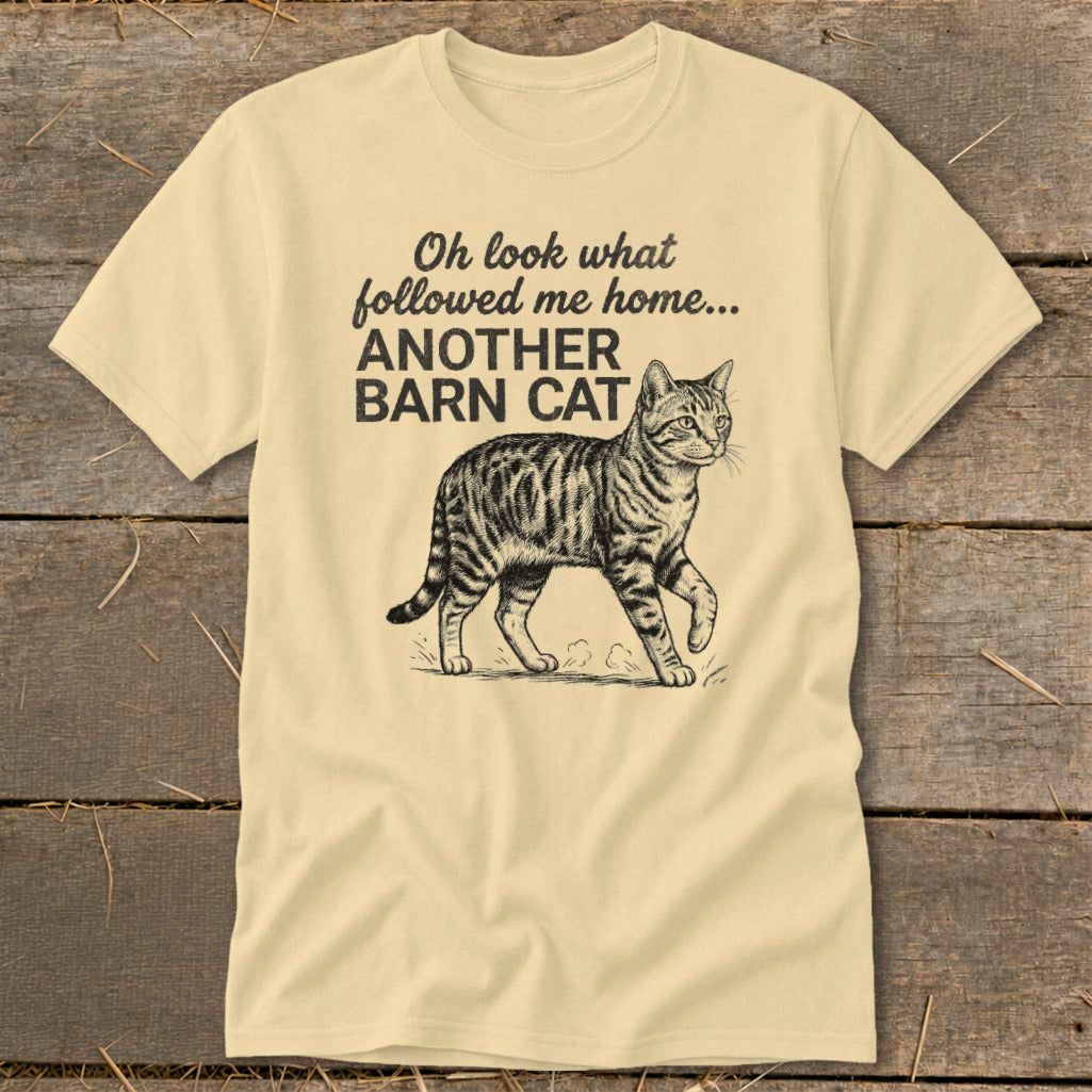 Cream t-shirt with illustration of a tabby cat and text "Oh look what followed me home... ANOTHER BARN CAT".