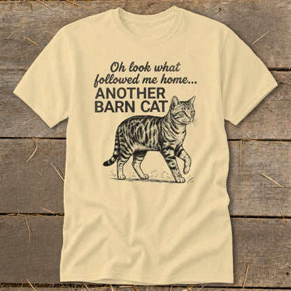 Cream t-shirt with illustration of a tabby cat and text "Oh look what followed me home... ANOTHER BARN CAT".