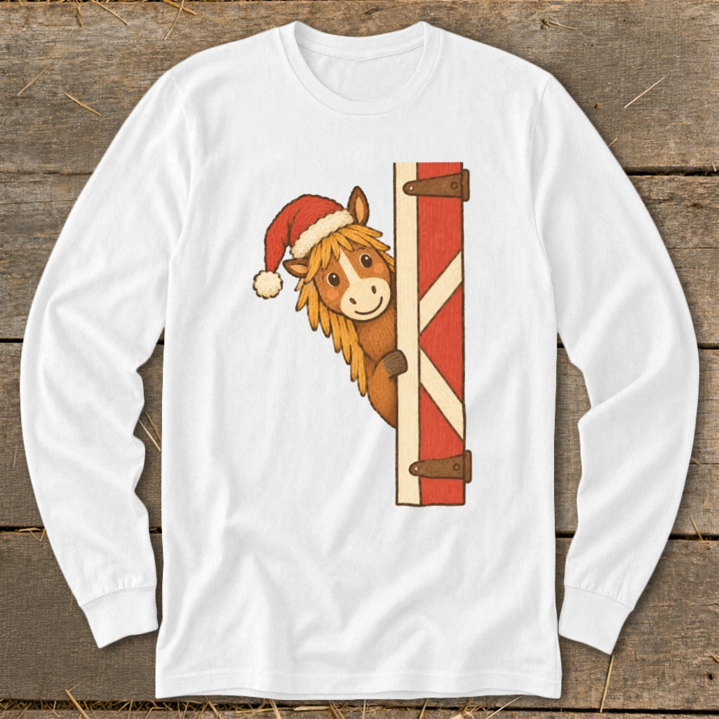 Brown horse wearing a Santa hat peeking from behind a red barn door.
