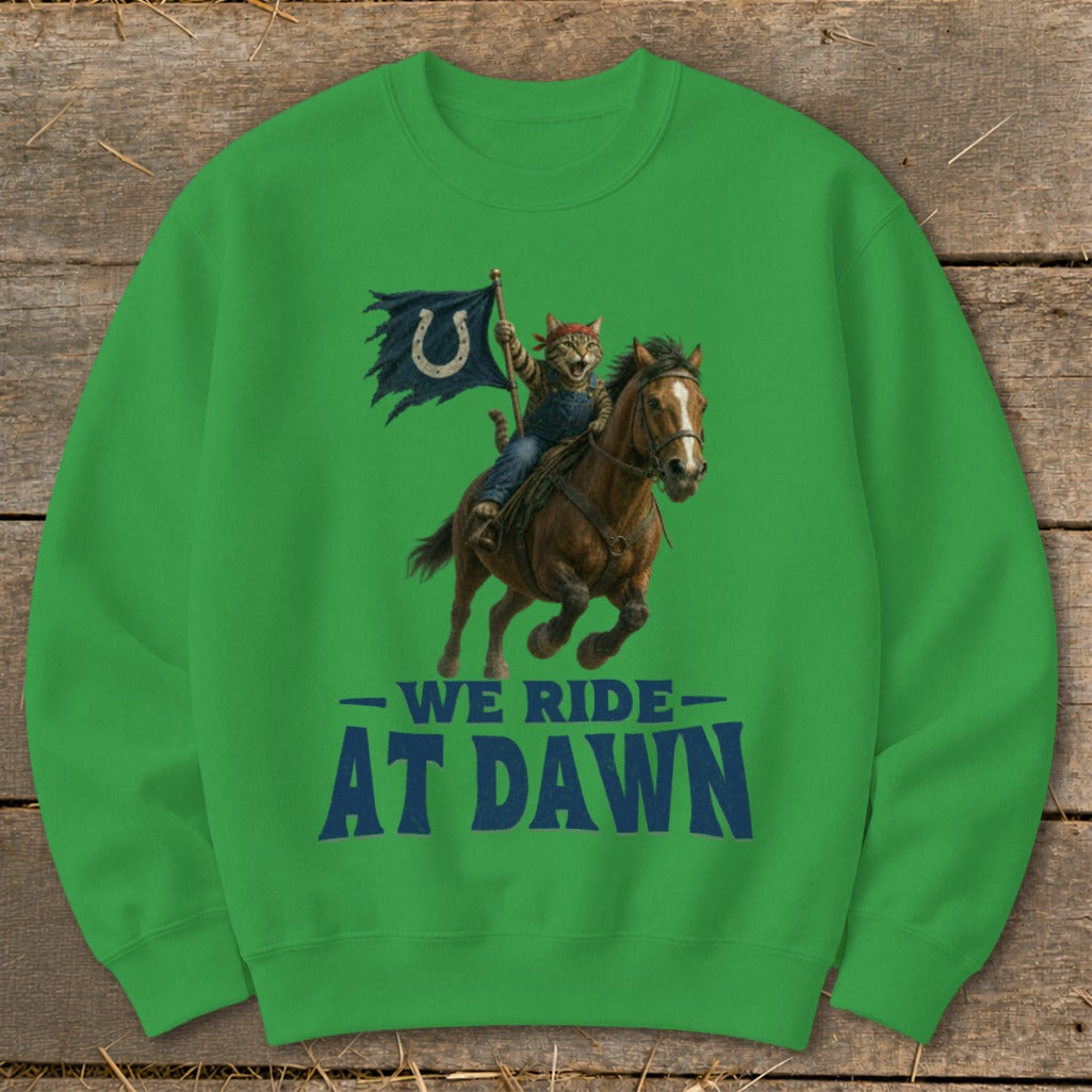 Green sweatshirt with cat riding horse holding Colts flag and text "We Ride At Dawn".