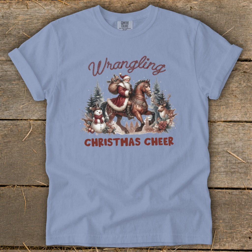 Santa on horseback with snowman and deer, reading "Wrangling Christmas Cheer".