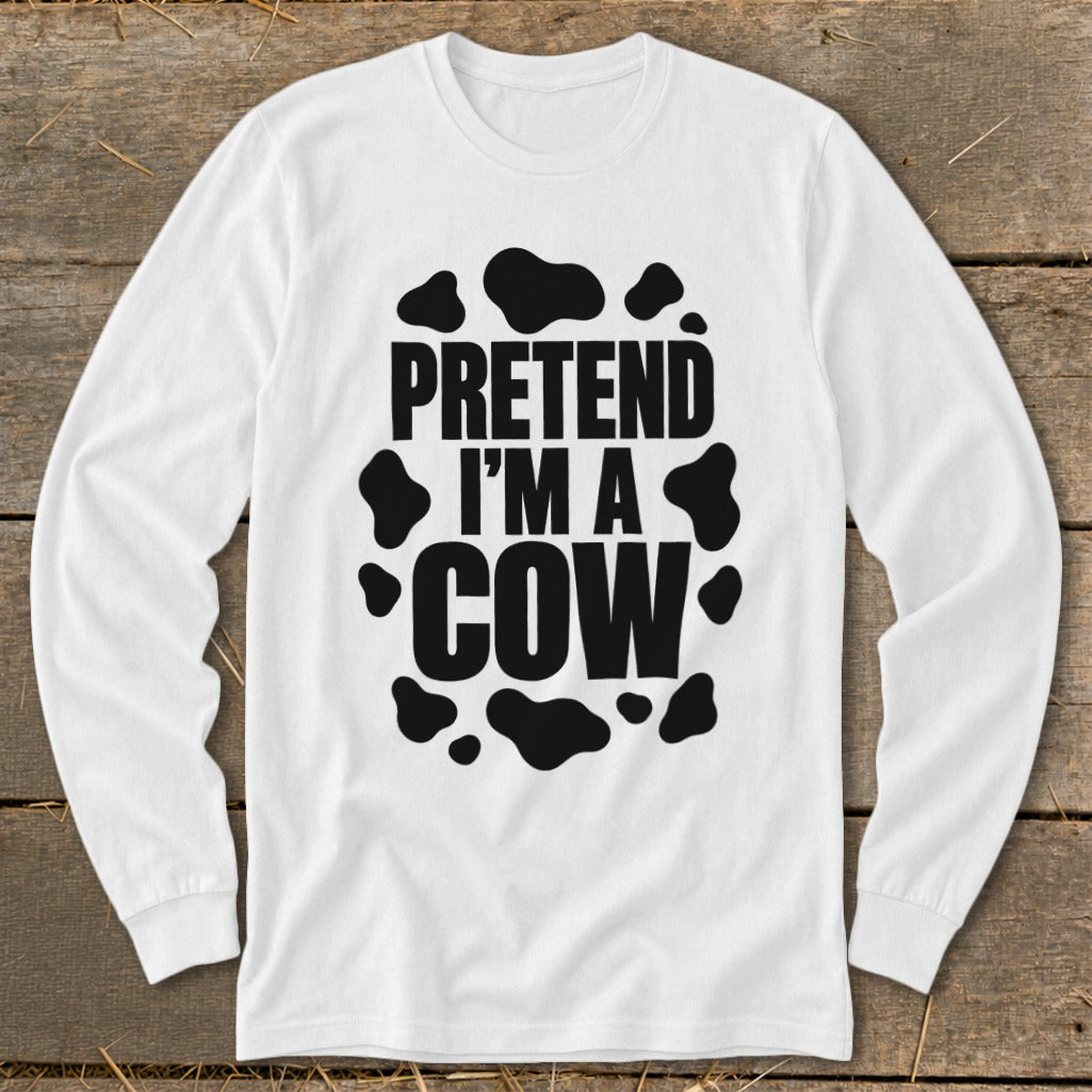 White long-sleeve shirt with black "Pretend I'm a Cow" text and spots.