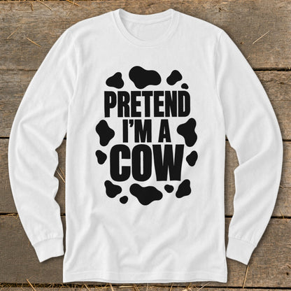 White long-sleeve shirt with black "Pretend I'm a Cow" text and spots.