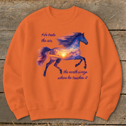 Orange crewneck sweatshirt featuring a galloping horse graphic filled with a sunset sky and inspirational text.