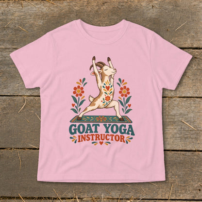 Pink t-shirt with a goat doing yoga, surrounded by flowers, and text "GOAT YOGA INSTRUCTOR".
