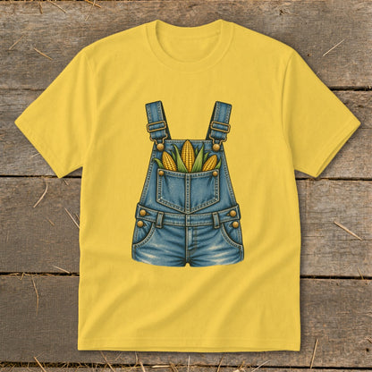 Yellow t-shirt with a graphic of denim overalls filled with corn on the cob.