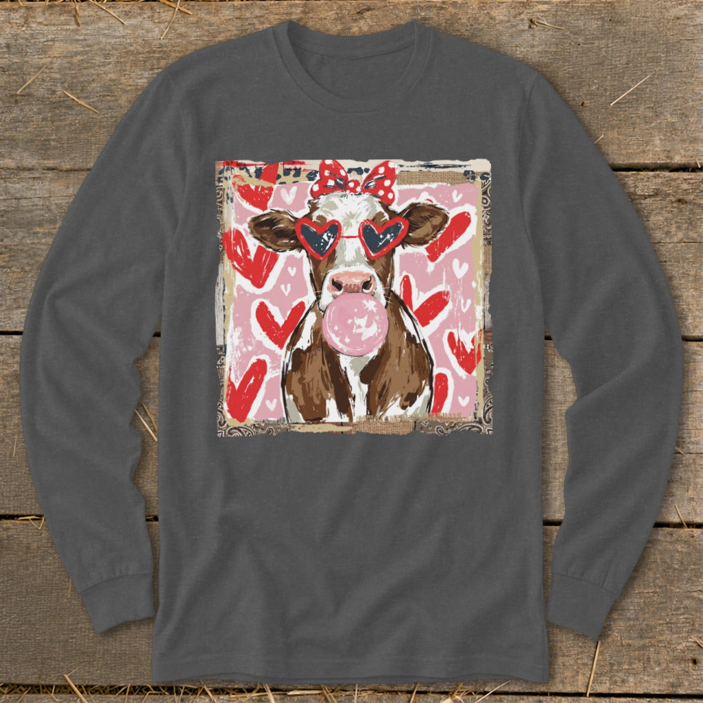 Cow with heart sunglasses and pink bubblegum on a pink background with hearts.