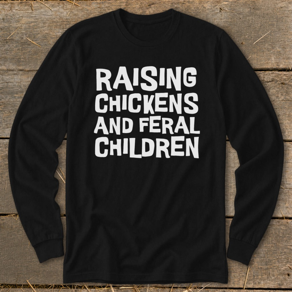 Black long sleeve shirt with white text reading "Raising Chickens and Feral Children".