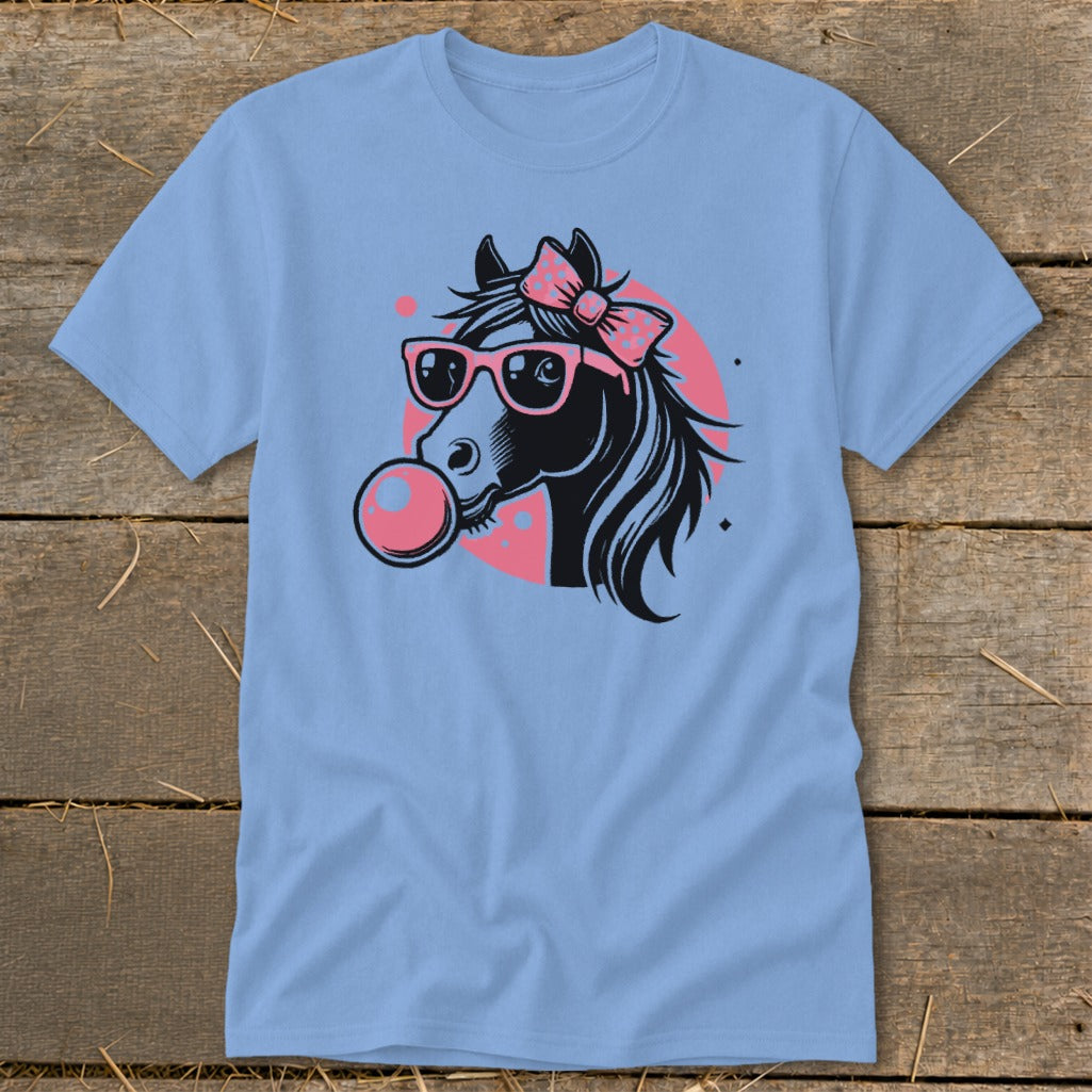 Light blue t-shirt with graphic of a horse wearing sunglasses and chewing gum.