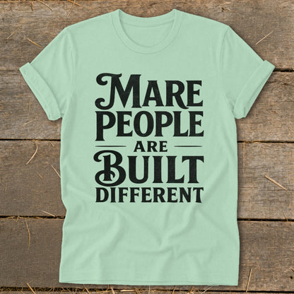Light green t-shirt with black text that reads "Mare People Are Built Different".