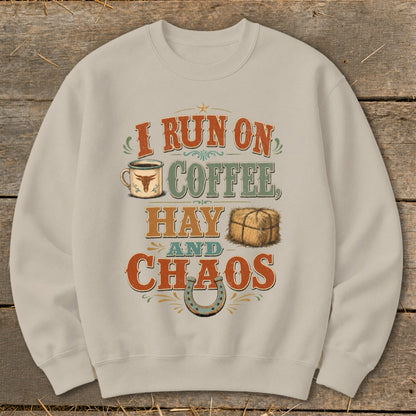 Sweatshirt with "I RUN ON COFFEE, HAY AND CHAOS" text and graphics.