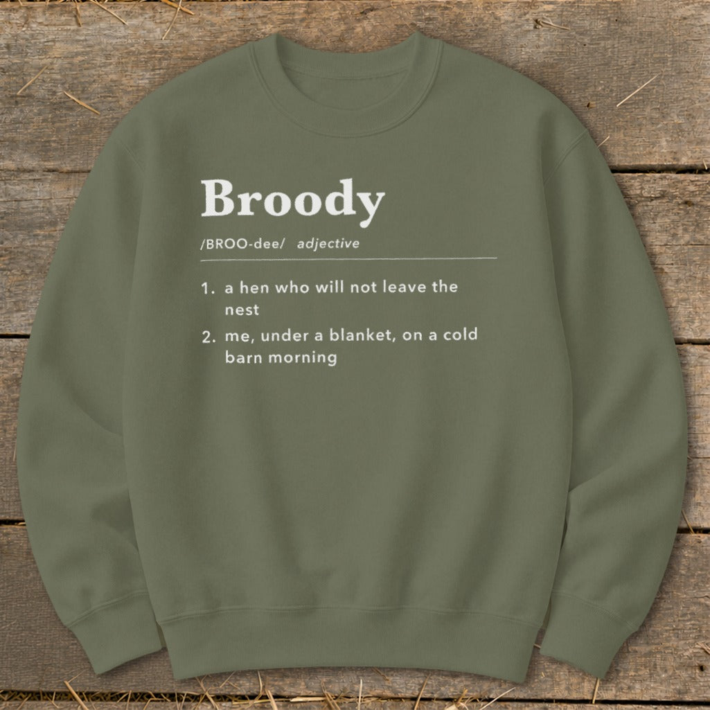 Olive green sweatshirt with white text defining "Broody" and two interpretations.