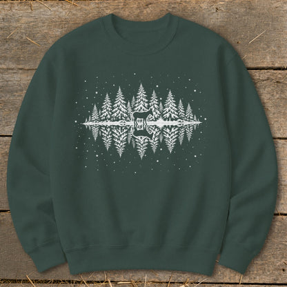 Dark green sweatshirt with white graphic of mirrored pine trees and a deer silhouette.