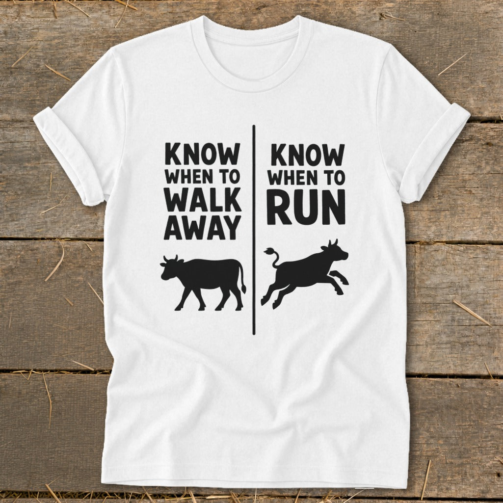 White t-shirt with black text and cow silhouettes that say "Know When to Walk Away" and "Know When to Run".