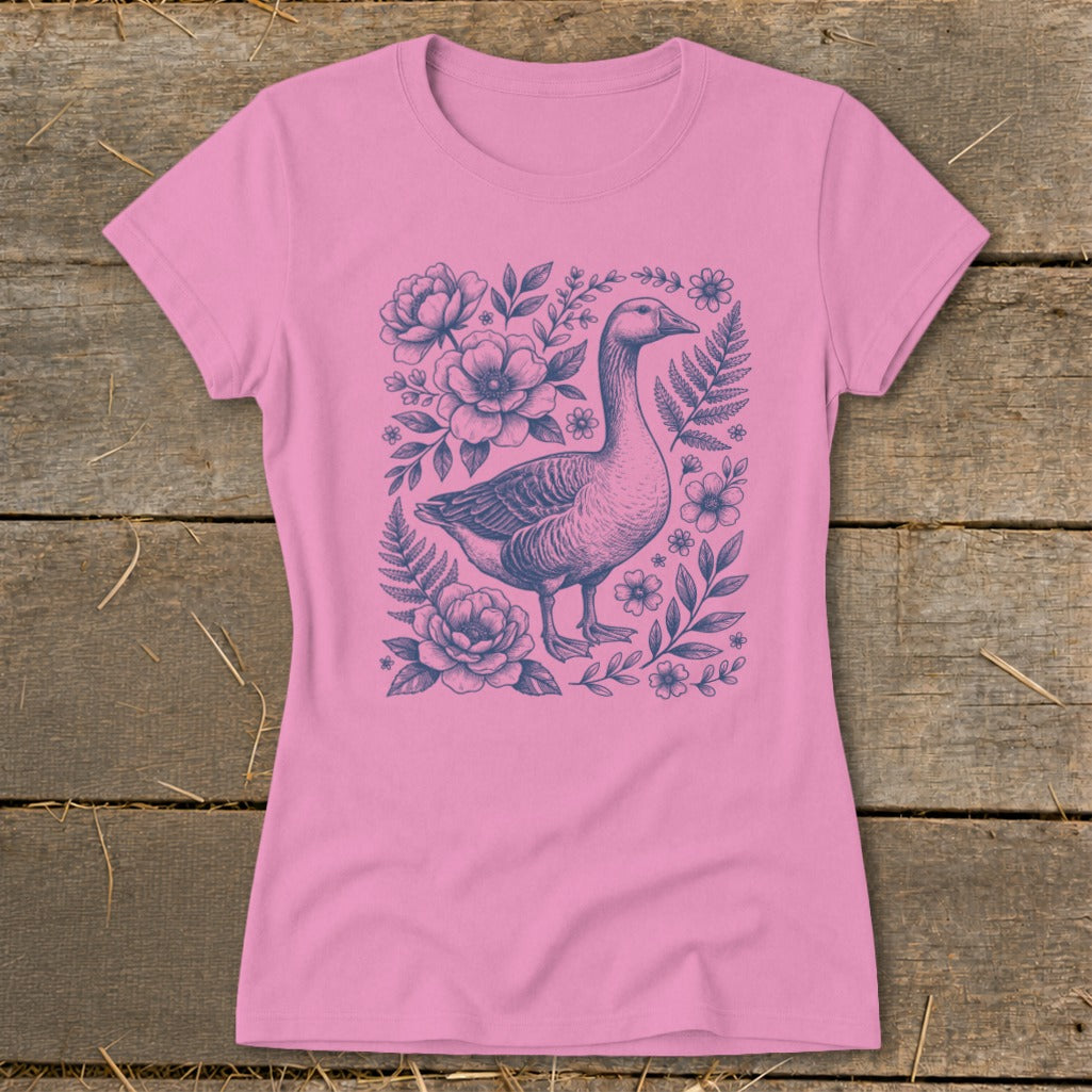 Pink t-shirt with a blue goose and floral design.