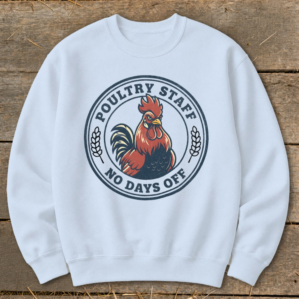 White sweatshirt with "Poultry Staff No Days Off" text and rooster graphic.