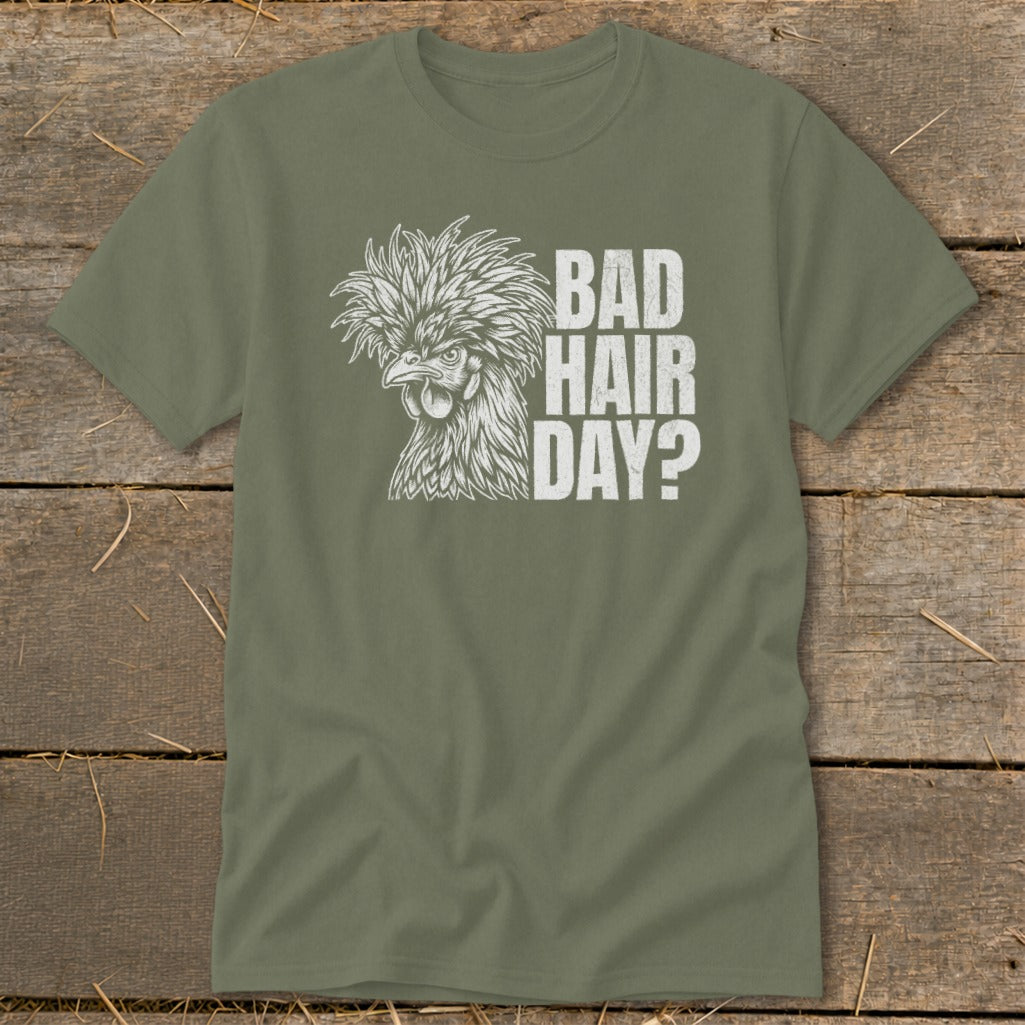 Olive green t-shirt with a white graphic of a fluffy chicken and "BAD HAIR DAY?" text.