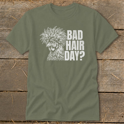 Olive green t-shirt with a white graphic of a fluffy chicken and "BAD HAIR DAY?" text.
