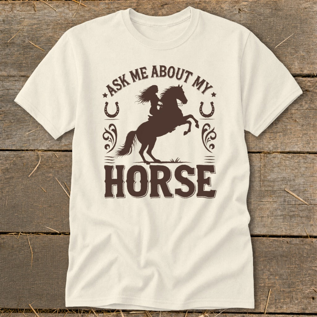 Cream t-shirt with dark brown text and graphic of rider on a bucking horse.