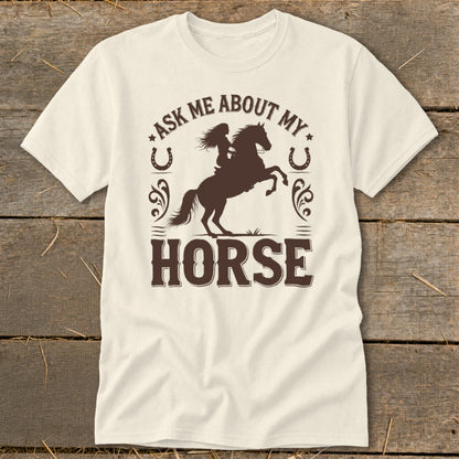 Cream t-shirt with dark brown text and graphic of rider on a bucking horse.