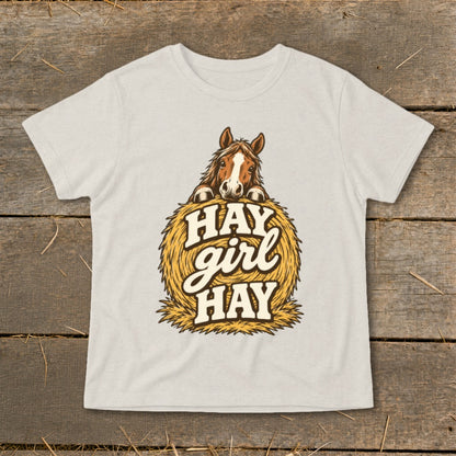 T-shirt with horse peeking over hay bale and text "Hay girl HAY."